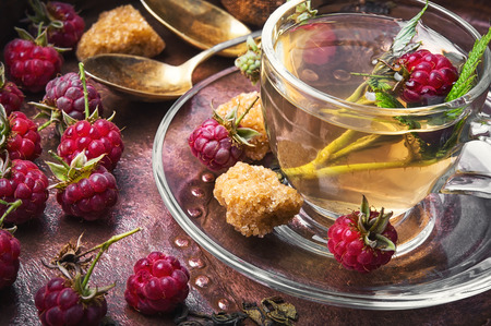 Herbal medicinal tea with ripe fresh raspberry berriesの写真素材