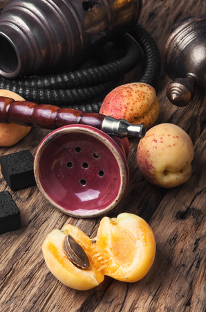 Smoking hookah with tobacco with apricot flavorの写真素材