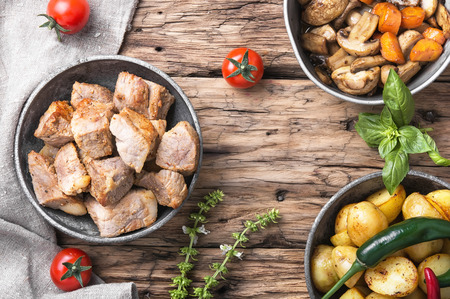 Lunch with fried pieces of pork and boiled potatoesの写真素材