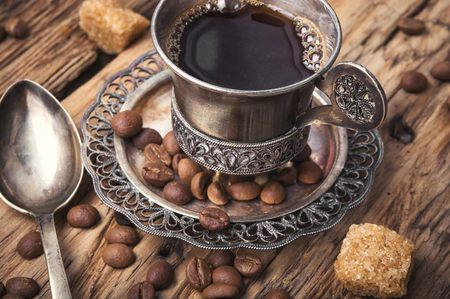 Vintage set with a cup of coffee on saucer in oriental styleの写真素材