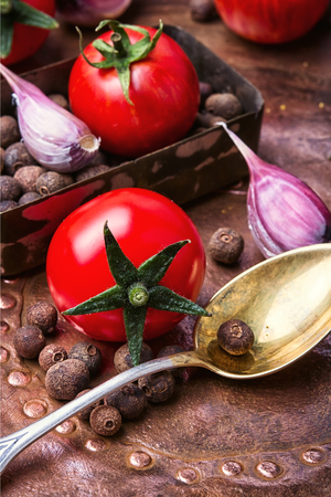 preserving autumn tomatoes with spices for the winterの写真素材