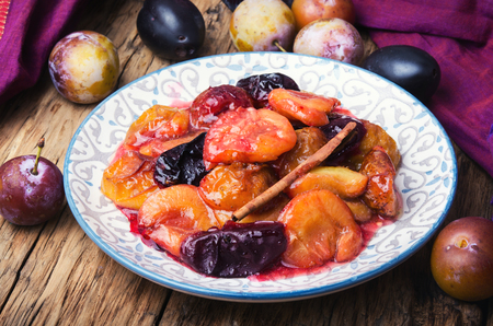 autumn dessert with plums baked in sweet caramelの写真素材