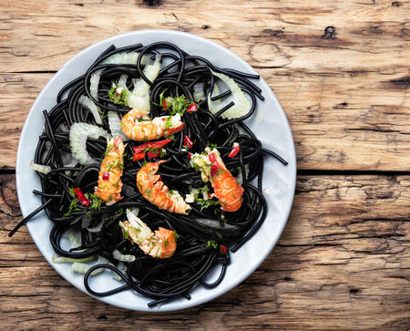 exquisite Italian dish - black pasta with seafoodの写真素材
