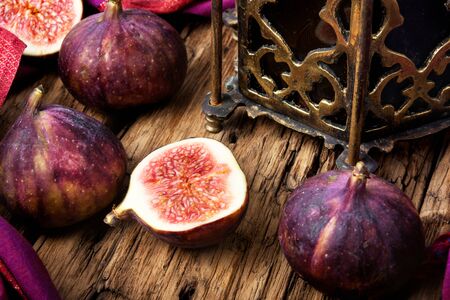 Turkish whole figs and figs, cut in half on a retro backgroundの写真素材