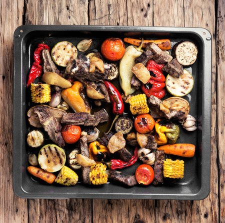Beef barbecue meat, grilled vegetables on tray.Background foodの写真素材