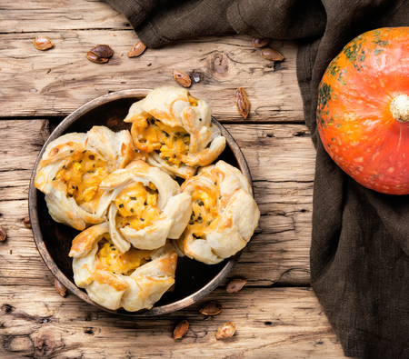 autumn pumpkin bun on retro wood backgroundの写真素材