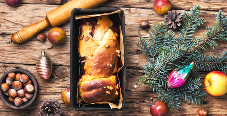 Christmas plum cake in a rustic style. Christmas decorations and foodの写真素材