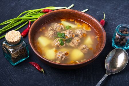 Meat soup with soup with meat balls in clay dish.Russian foodの写真素材