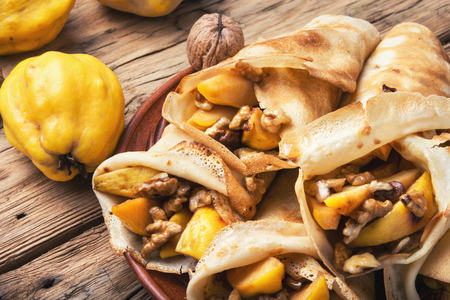 homemade pancakes stuffed with quince and walnutの写真素材