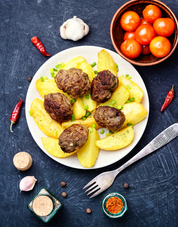 Meat cutlets and fried potatoes for garnishの写真素材