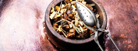 mix of fruit tea leaf in a wooden pot