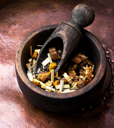 mix of fruit tea leaf in a wooden bowlの写真素材