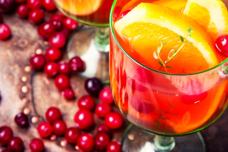 Sangria with orange and berries in a glass gobletの写真素材