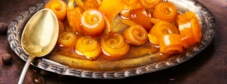 Homemade orange candied peels orange in retro trayの写真素材