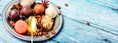 Assortment of chocolate candies on a stylish dishの写真素材