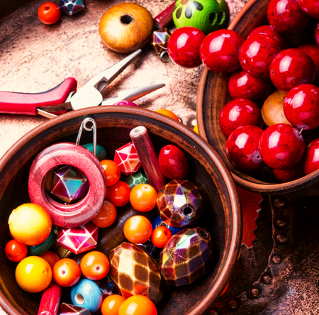 Hobby jewelry making and beading handmade process.Colored beads.Handicraftの写真素材