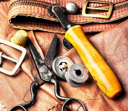 Working tools and cut out pieces of leather