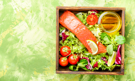Salmon with vegetables and lettuce in box.Healthy eatingの写真素材