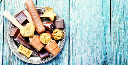 Assortment of chocolate candies on stylish dish.Chocolate dessertの写真素材
