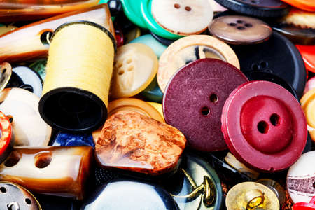 Large set of plastic buttons for clothing.Background made of buttons. Sewing elements