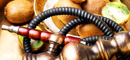 Smoking Turkish hookah with taste of kiwi.Fruit aroma of shisha
