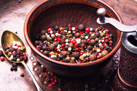 set of peppers and a mill for grinding seasonings and spicesの写真素材