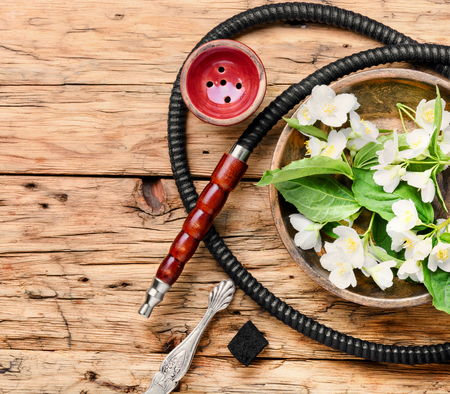 Smoke hookah with jasmine floral scent.Shisha concept.Modern hookahの写真素材