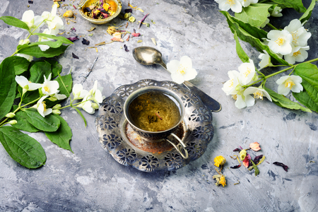 Oriental tea set with tea from jasmine flowers.Jasmine teaの写真素材