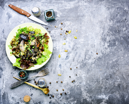 Autumn salad with wild mushrooms and lettuce.Vegetarian foodの写真素材