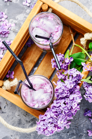 Refreshing summer cocktail with lilac flowers.Detox drinkの写真素材