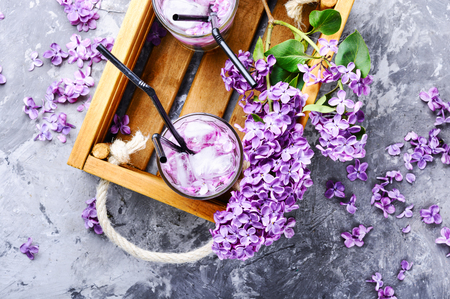 Refreshing summer cocktail with lilac flowers.Detox drinkの写真素材
