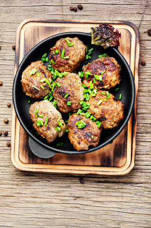 Roasted beef meatballs in cast-iron skillet.Delicious cutletの写真素材