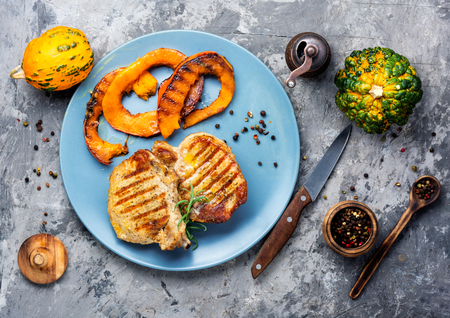Baked meat with pumpkin on plate.Steak with pumpkinの写真素材