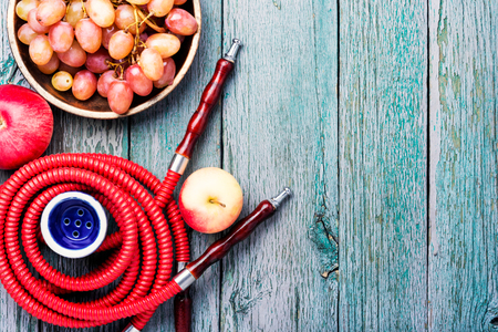 Turkish smoking hookah with taste of a fruit mixture of grapes and apples.Shisha concept. Fruit taste of hookah.の写真素材