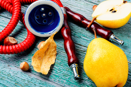 Oriental shisha hookah with aroma pear for relax.Pear shisha.Autumn hookah menuの写真素材