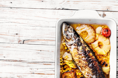 Delicious roasted fish with pineapple.Fishes baked in baking dishの写真素材