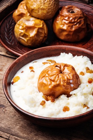 Traditional rice porridge on milk with applesの写真素材