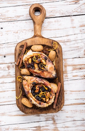 Fried fish steaks stuffed with raisins and almonds.Grilled fish steakの写真素材