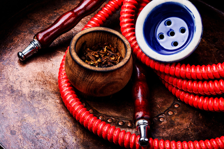 Oriental exotic hookah .Smoking turkish shisha.Tobacco in a snuffbox and hookahの写真素材