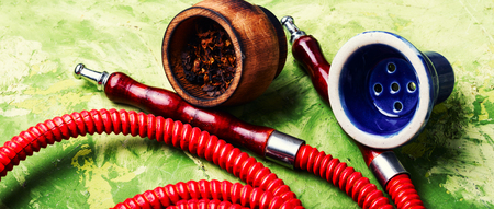 Oriental exotic hookah .Smoking turkish shisha.Tobacco in a snuffbox and hookah