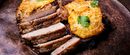 Pork steak baked with pineapple.Fresh grilled meatの写真素材
