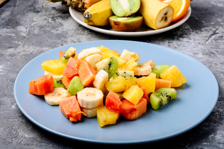 Fresh fruit salad on gray stone table.Colorful fruit saladの写真素材