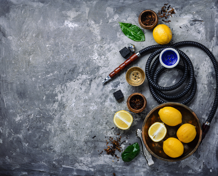 East hookah with fruit aroma for relax.Shisha hookah.Hookah with lemon.Lime smoking tobaccoの写真素材