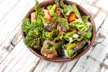 Fresh salad plate with mixed greens.Rhubarb salad.Vegetarian spring saladの写真素材