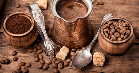 Roasted coffee beans and ground coffee.Coffee beans on wood backgroundの写真素材