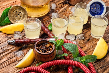 Smoking hookah and glasses with alcoholic lemon