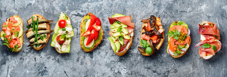 Bruschetta with various toppingsの写真素材