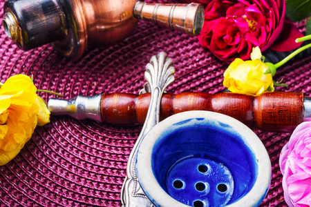 Smoking hookah with floral tobacco flavorの写真素材