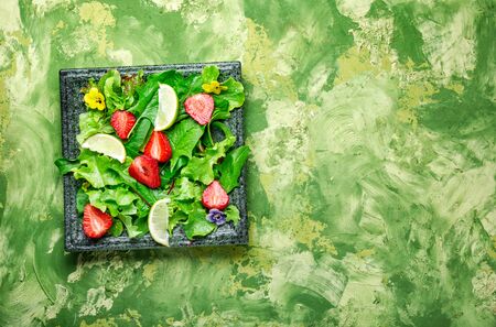 Salad with greens, strawberries and lime.Summer food.Healthy foodの写真素材