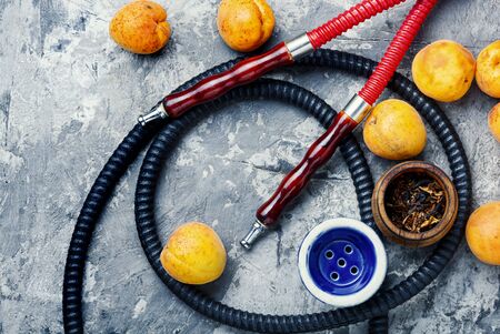 Details of the eastern kalian.Hookah with apricots flavor.Smoking apricots tobacco.Fruit hookah flavorの写真素材